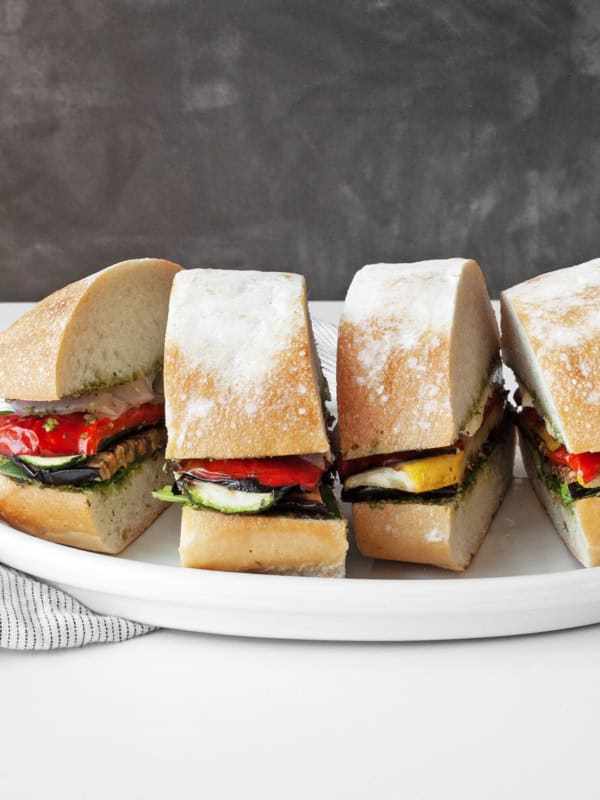 Grilled vegetable ciabatta sandwiches on a plate.