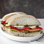 Ciabatta sandwiches on a plate.