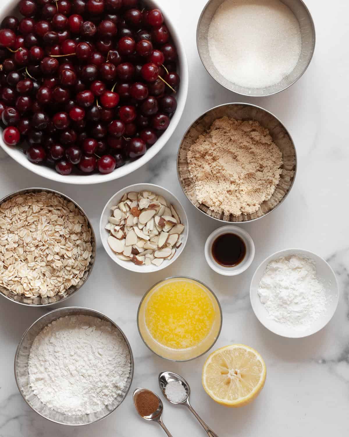 Cherries, granulated sugar, brown sugar, oats, flour, almonds, lemon, melted butter, vanilla extract, cinnamon and cornstarch.