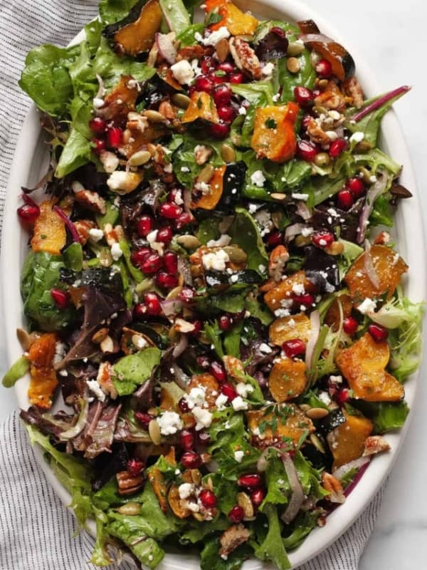 Roasted squash salad on an oval serving platter.