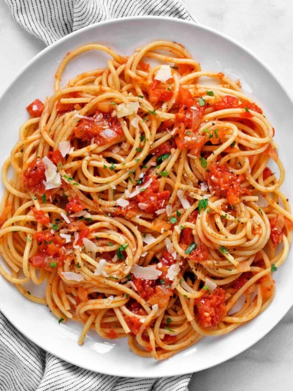 Spaghetti with roma tomato sauce on a plate.