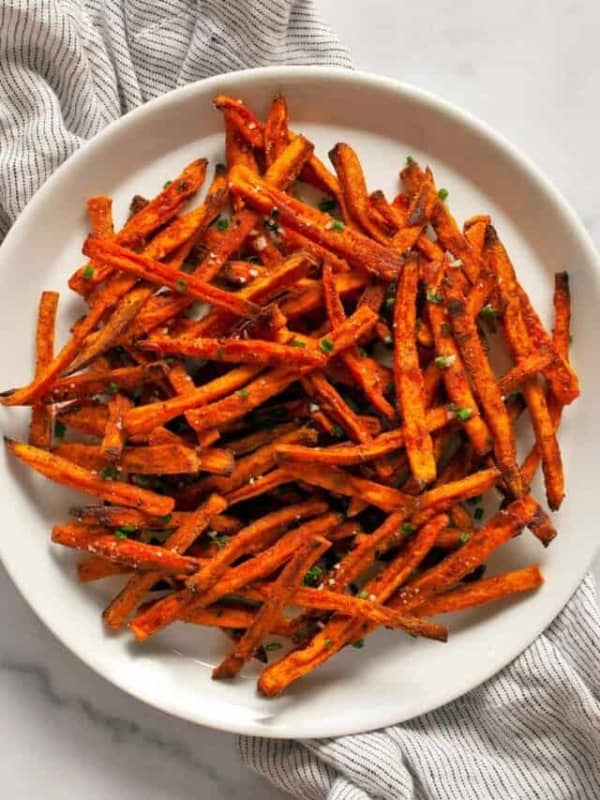 Oven baked sweet potato fries on a plate.