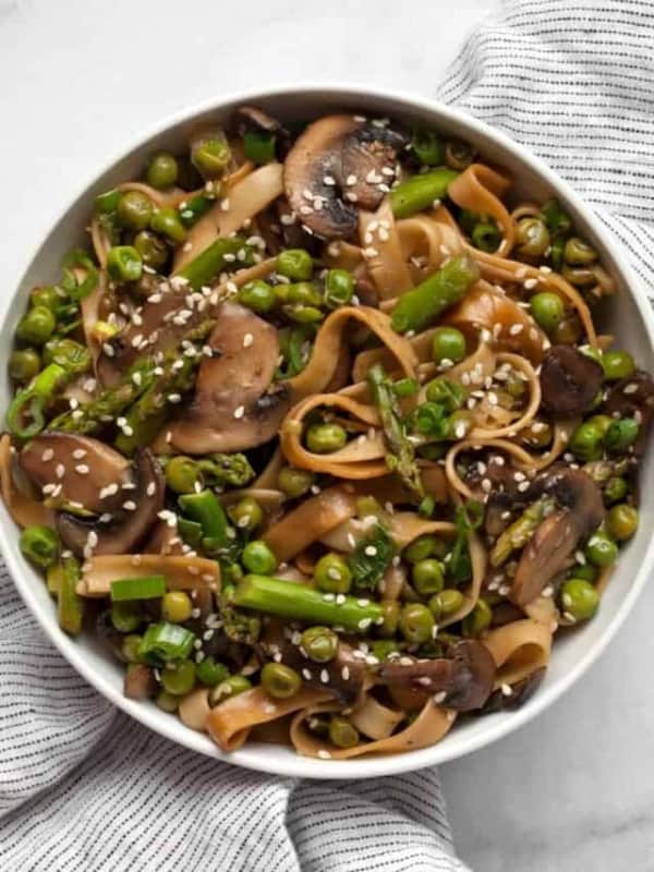 Asparagus, mushroom and pea stir-fry in a bowl.