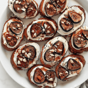 Toasted bread with whipped goat cheese and roasted figs, chopped nuts and rosemary.