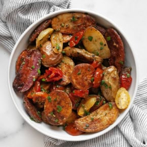 Roasted tomato pesto potato salad in a bowl.