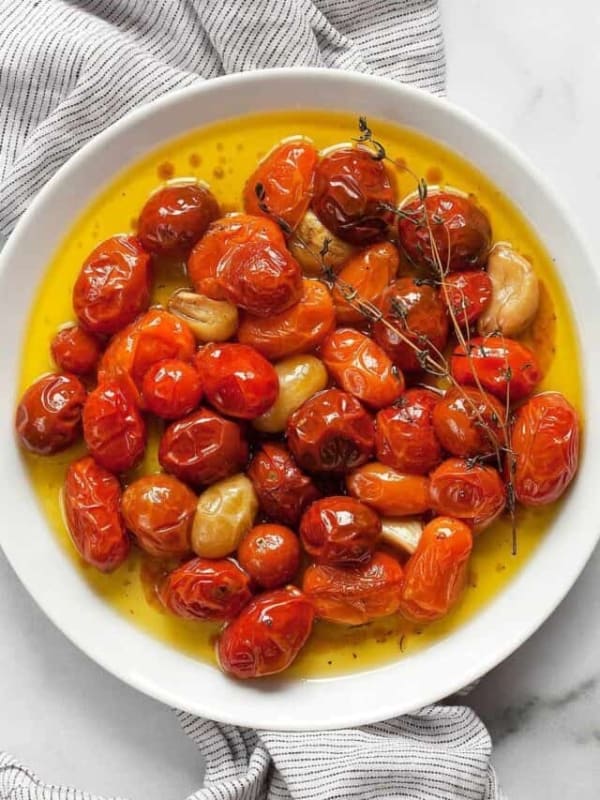 Cherry tomato confit on a plate.