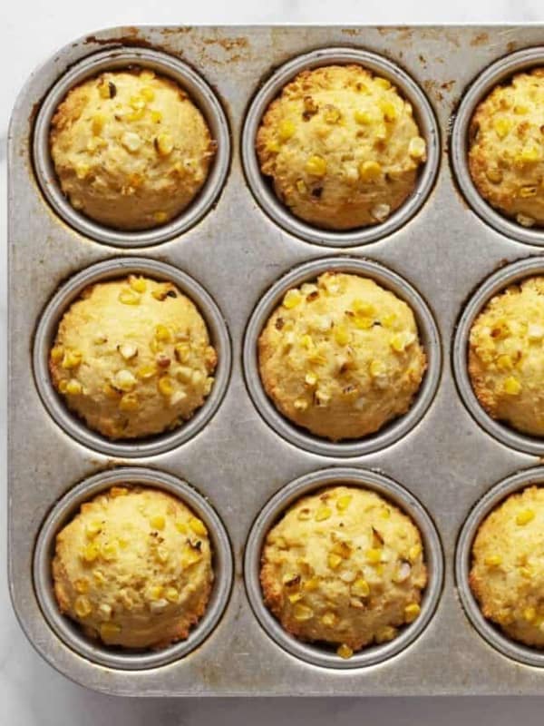 Cornbread muffins in a pan.