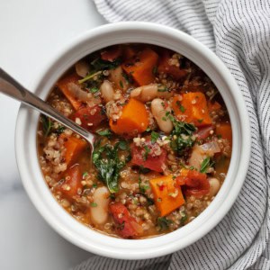 Sweet potato white bean quinoa soup in a pot.