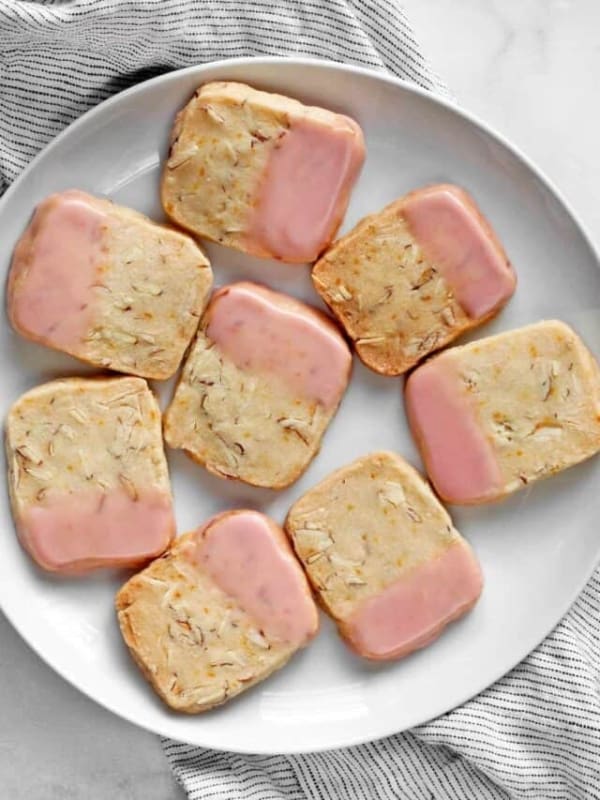 Eight icebox cookies on a plate.