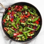 Peanut vegetable stir-fry in a skillet.