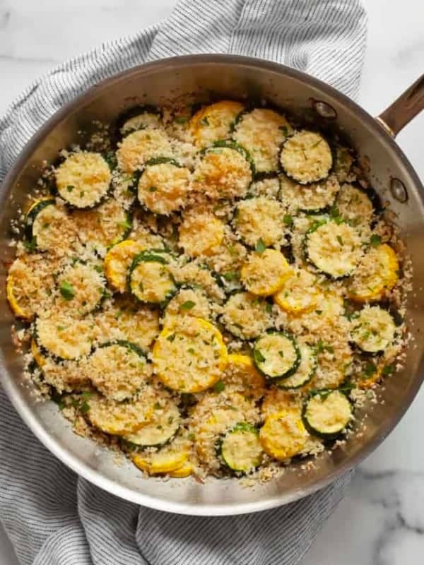 Summer squash casserole in a skillet.