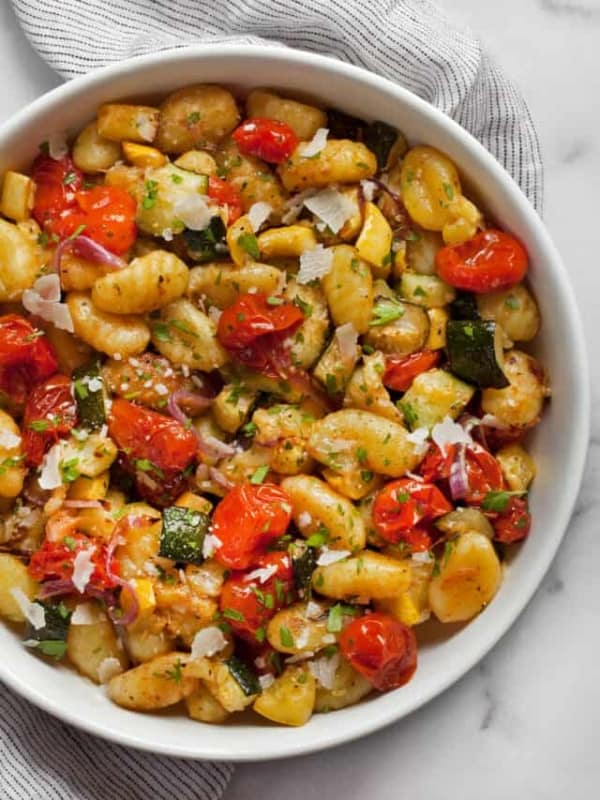 Sheet pan gnocchi with roasted vegetables in a bowl.