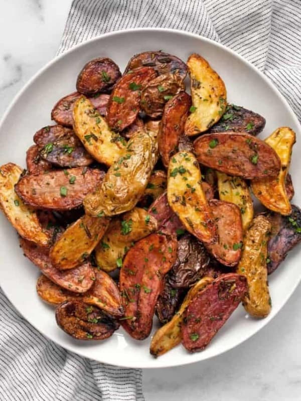 Roasted rosemary potatoes on a plate.