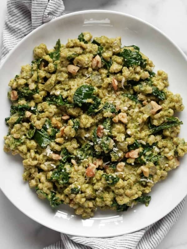 Baked kale barley risotto on a plate.