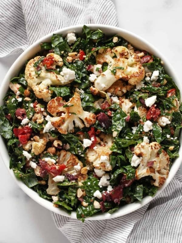 Kale salad with roasted cauliflower, tomatoes, olives and feta.