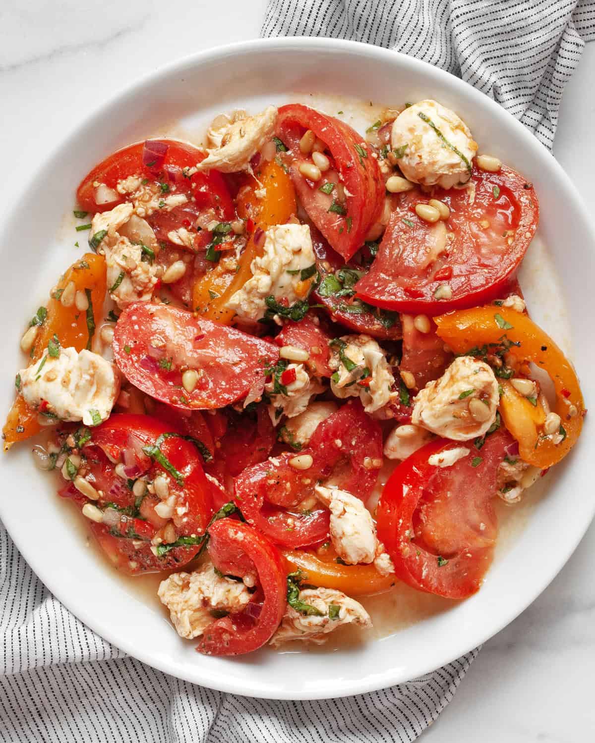 Tomato mozzarella salad on a plate.