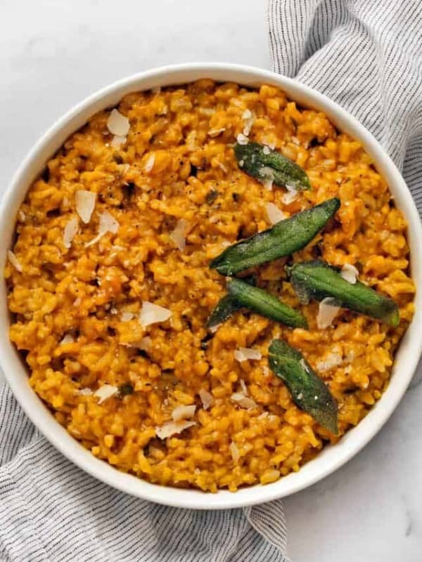 Baked pumpkin risotto in a large white bowl.