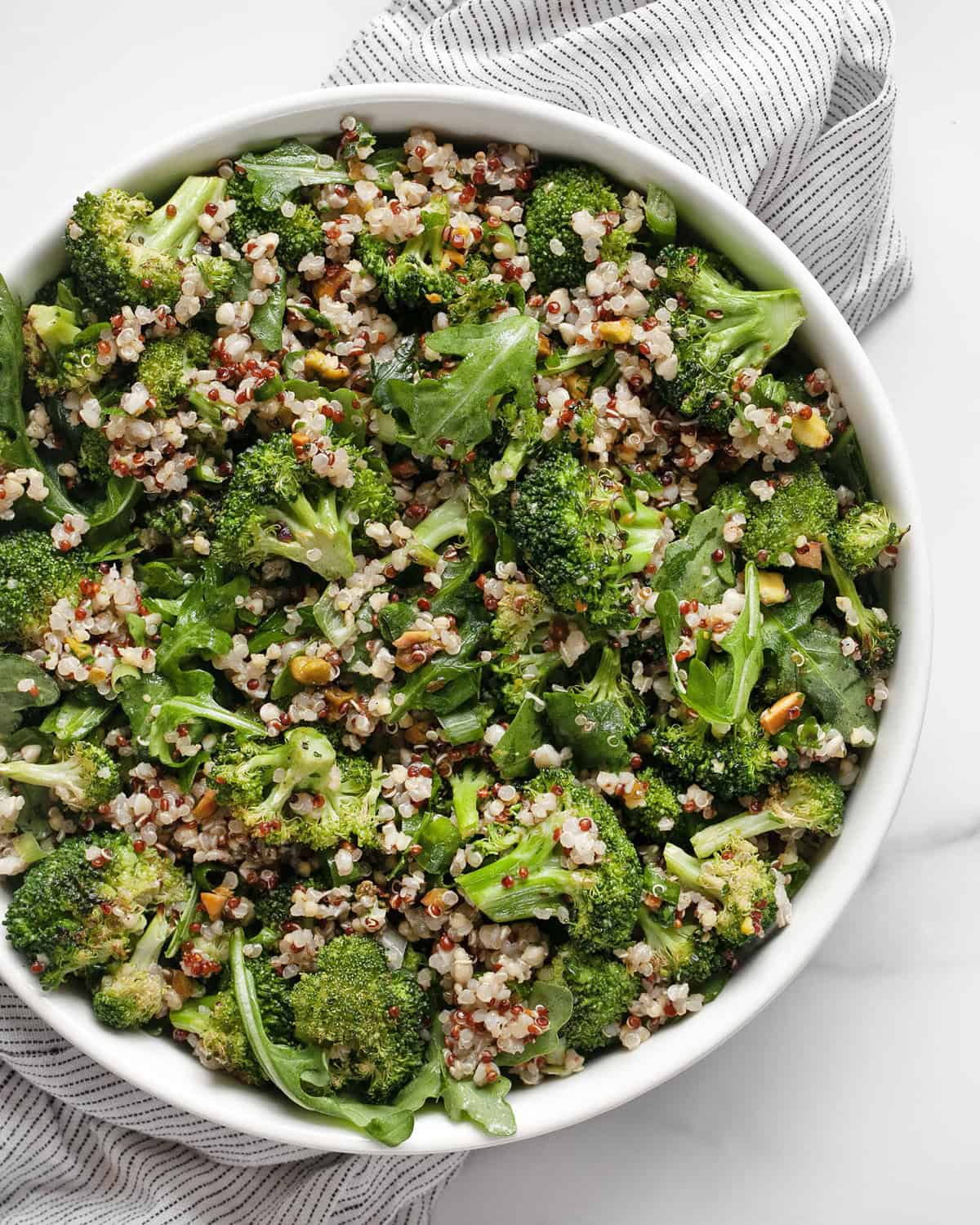 Roasted broccoli quinoa salad in a bowl.