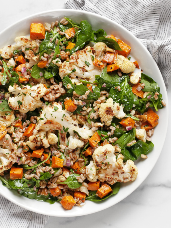 Roasted sweet potato cauliflower salad on a plate.