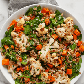 Roasted sweet potato cauliflower salad on a plate.