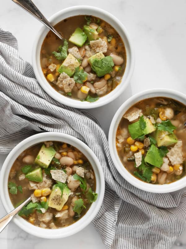 Three bowls of white bean chili.