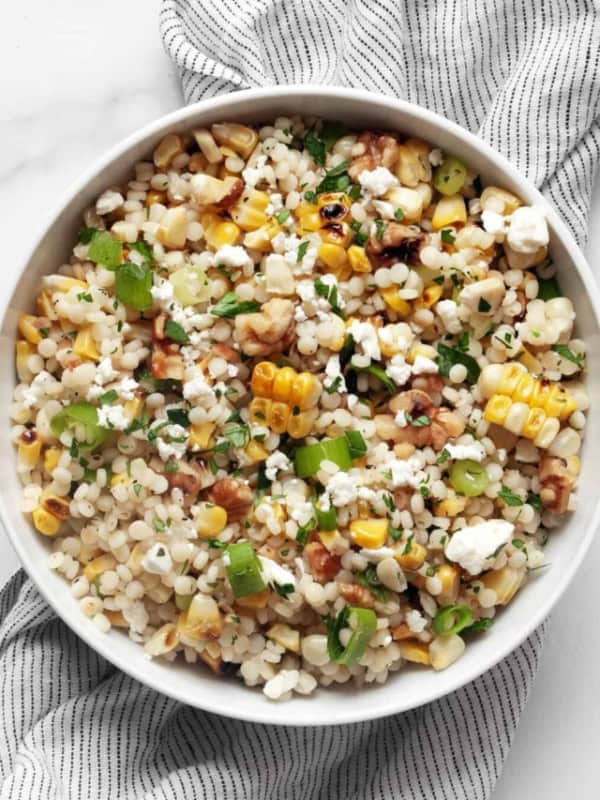 Grilled corn pearl couscous in a bowl.