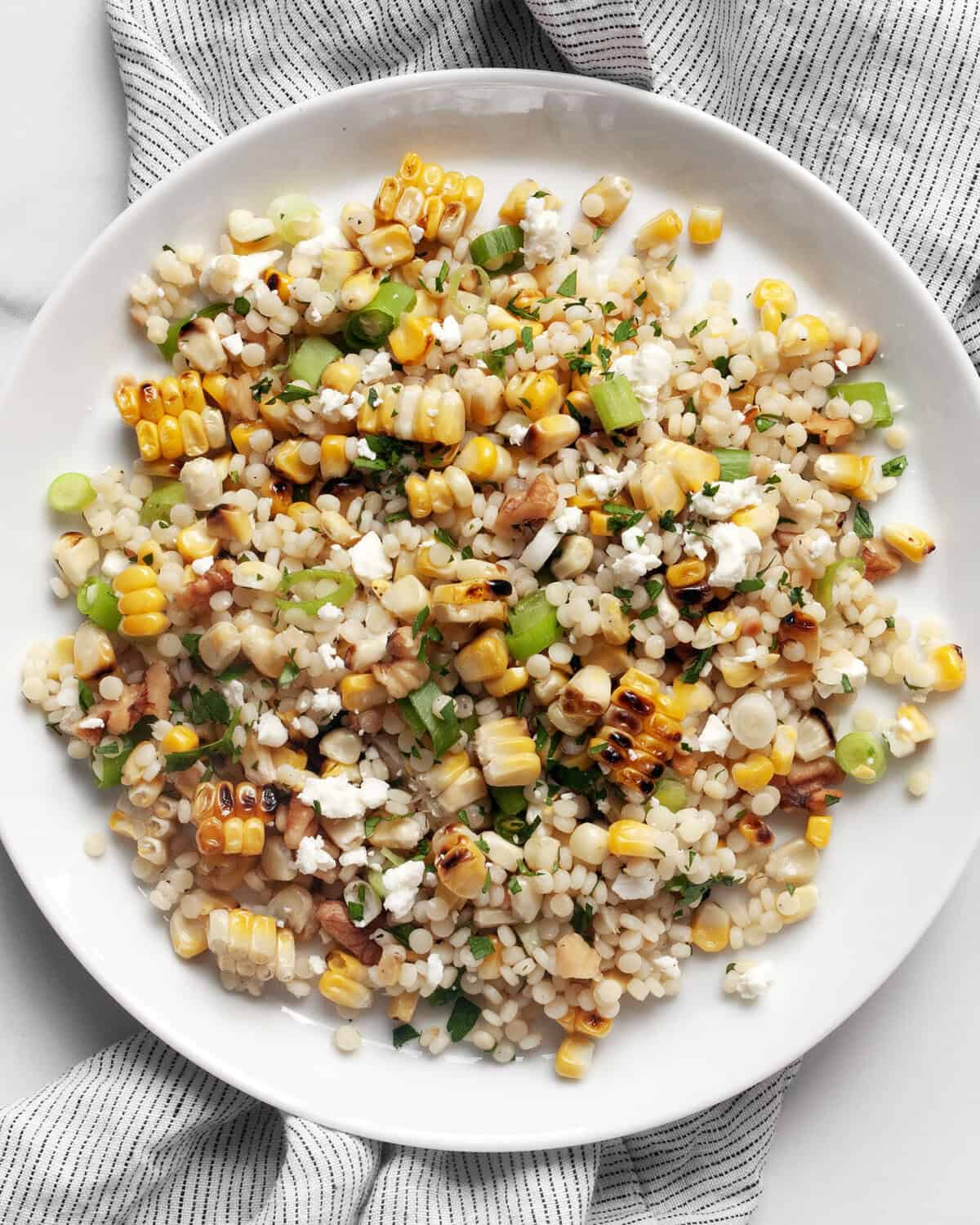 Grilled corn couscous on a plate.