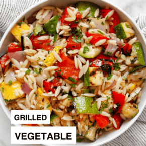 Orzo salad with grilled vegetables in a bowl.