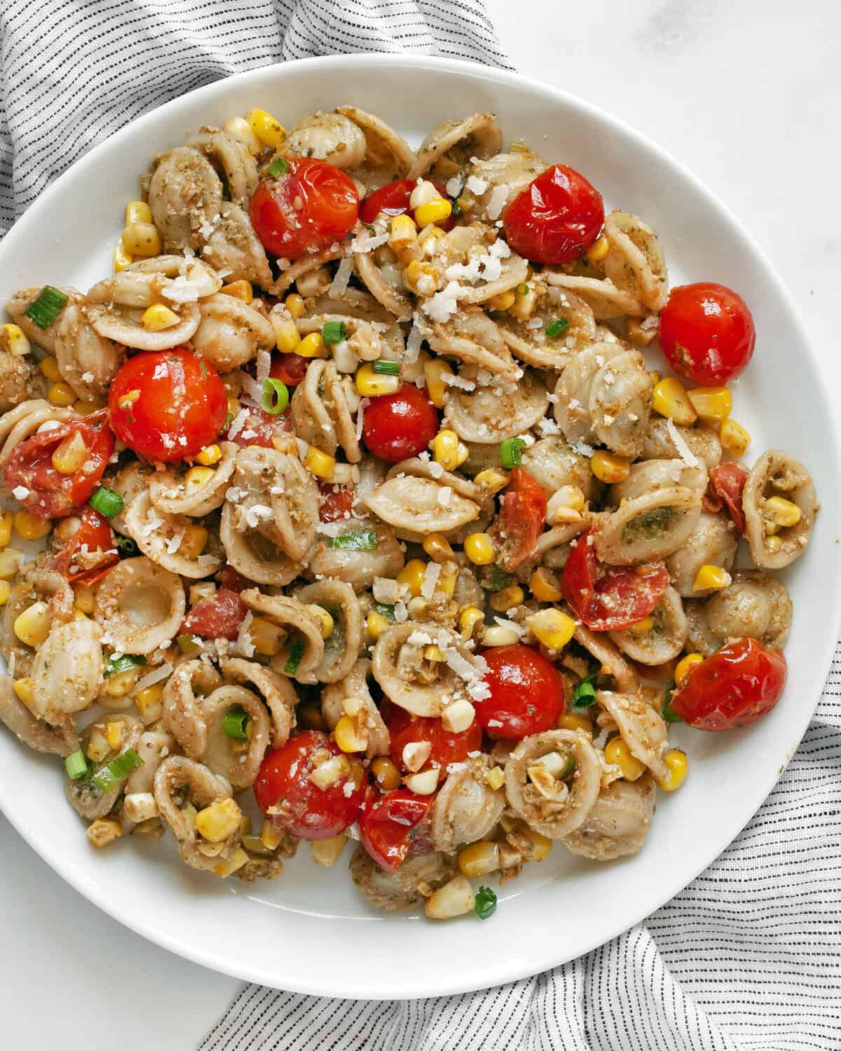 Easy tomato corn pasta on a plate.