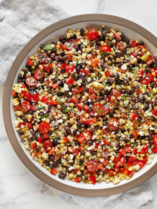 Grilled corn black bean salad in a large serving bowl.