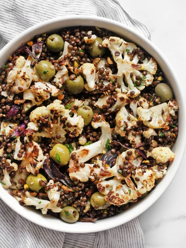 Roasted cauliflower lentil salad in a bowl.