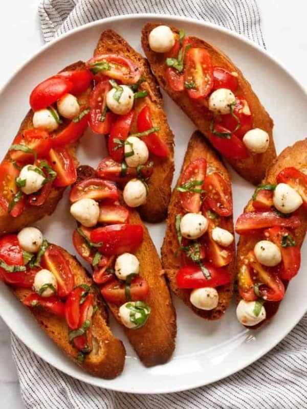 Caprese bruschetta on a plate.