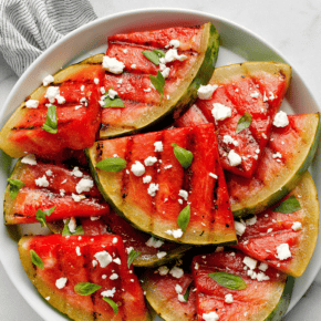 Topped with crumbled feta and fresh herbs, this grilled watermelon is smoky and sweet. If you’ve never grilled watermelon before, it’s a simple way to caramelize it and add flavor along with those all-important grill marks. Then enjoy it as an appetizer, salad or side that's perfect for summer barbecues.