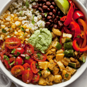 Vegetarian burrito bowl with cilantro lime rice, pico de gallo and black beans.