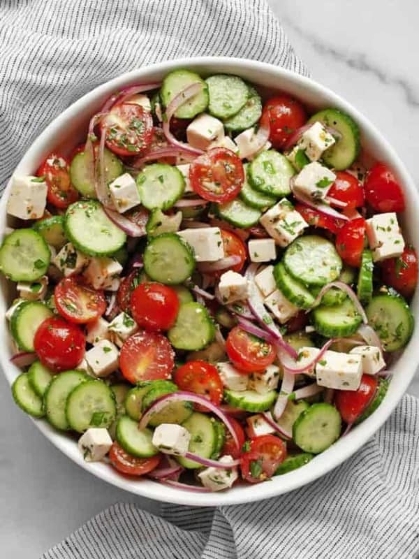 Tomato cucumber feta salad in a bowl.