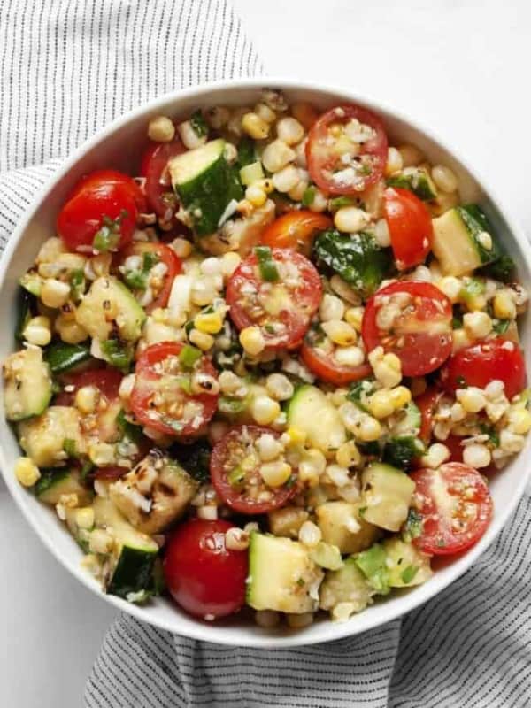 Zucchini and corn salad in a small bowl.