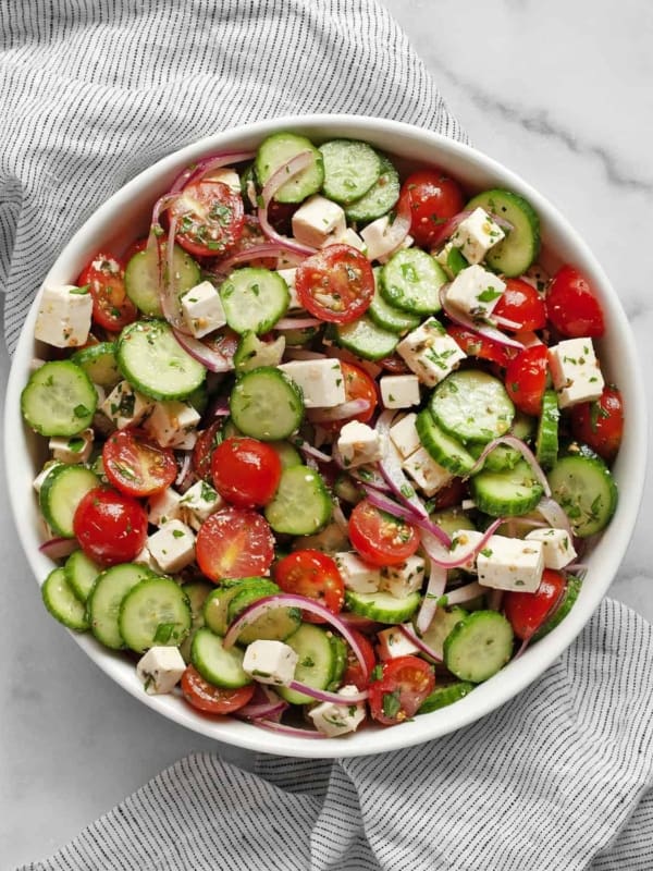 Tomato cucumber feta salad in a bowl.