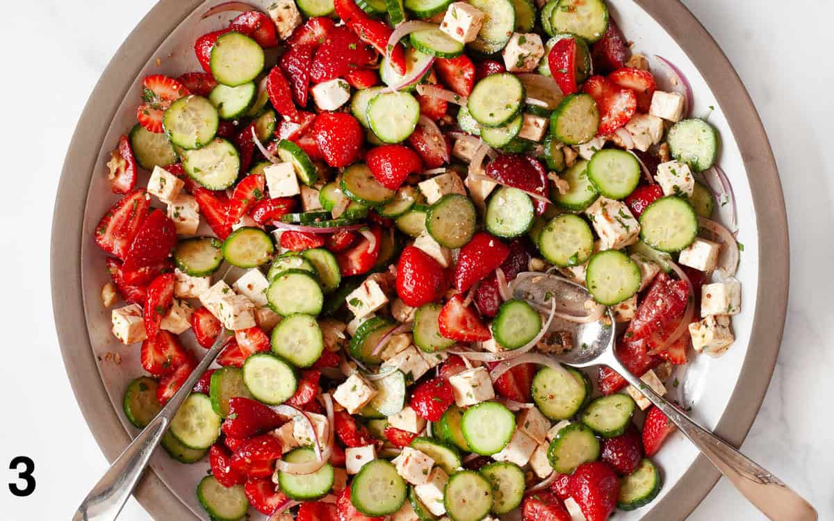 Salad ingredient tossed in dressing.