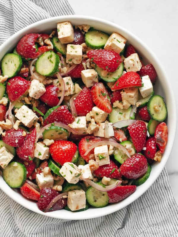 Strawberry cucumber feta salad in a bowl.