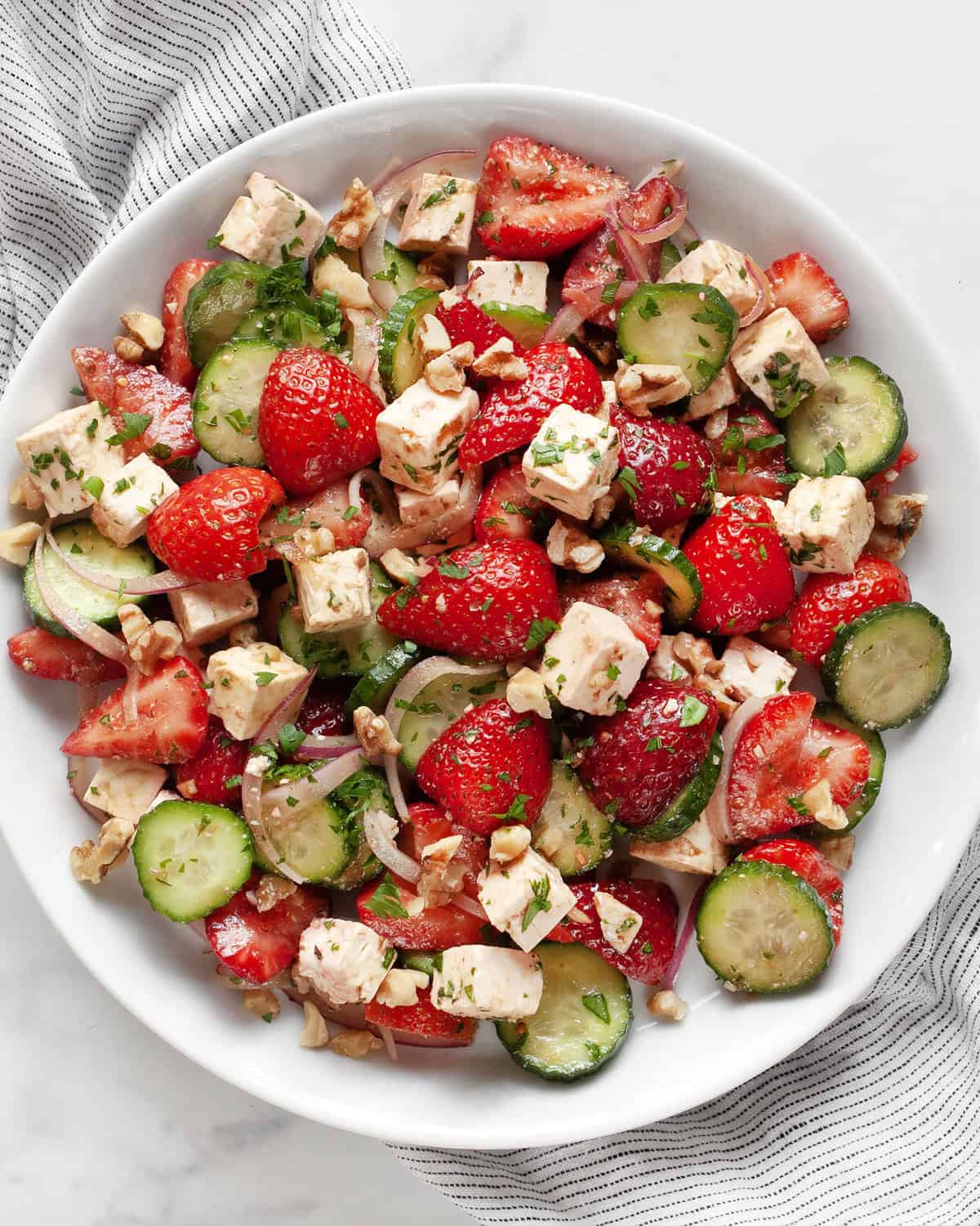 Strawberry feta salad on a plate.