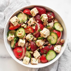 Strawberry cucumber feta salad in a bowl.