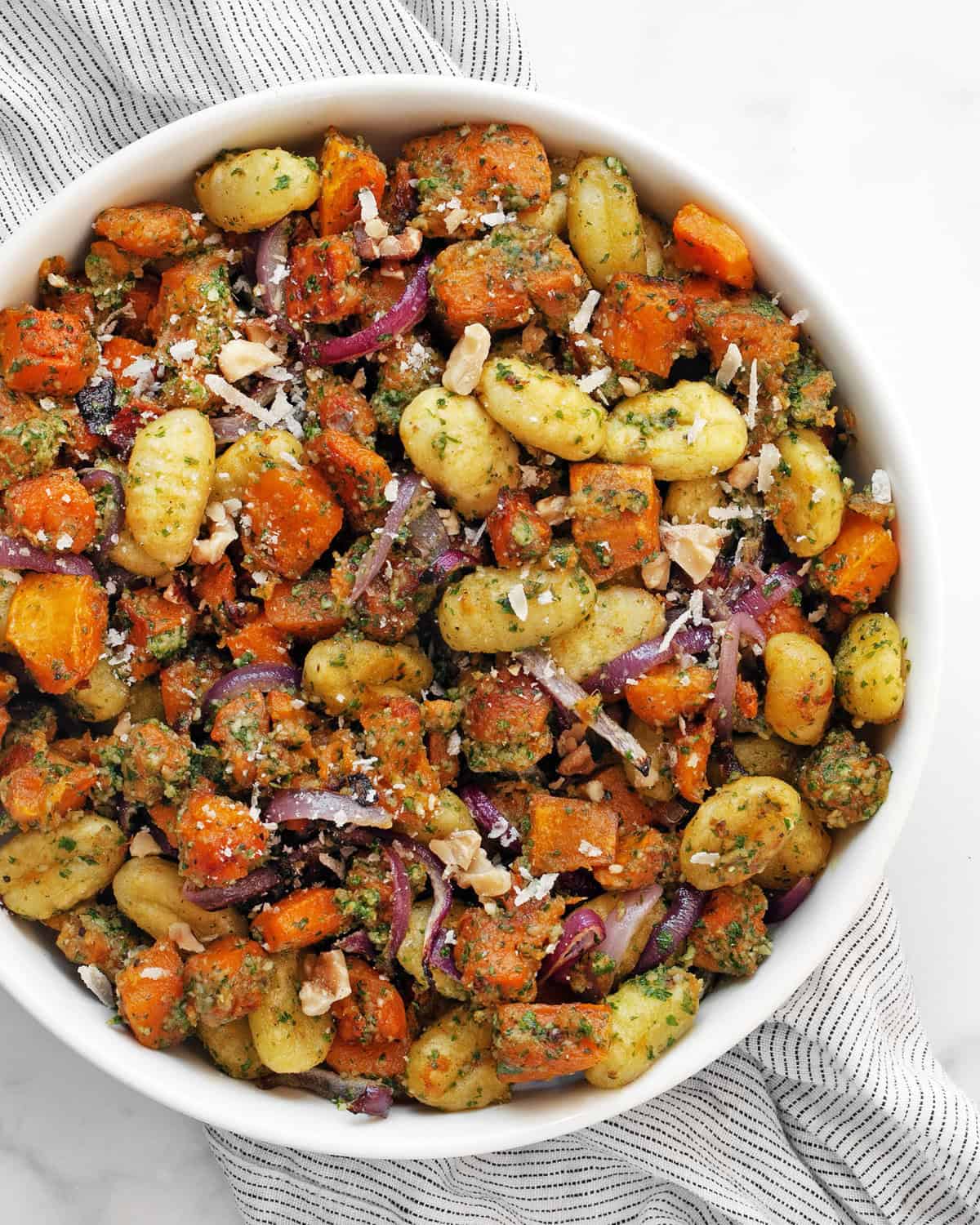 Roasted butternut squash sheet pan gnocchi in a bowl.