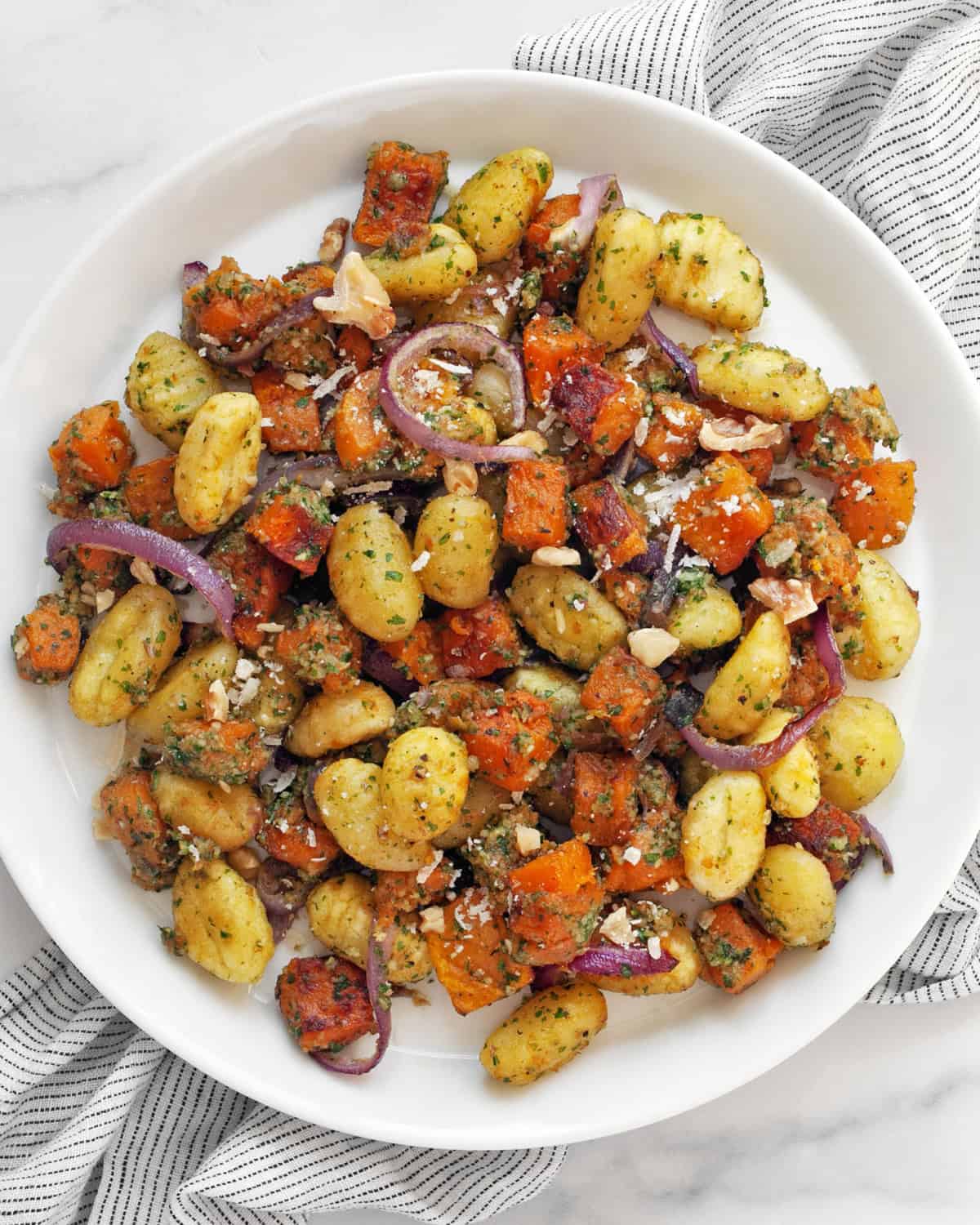 Roasted butternut squash sheet pan gnocchi in a plate.