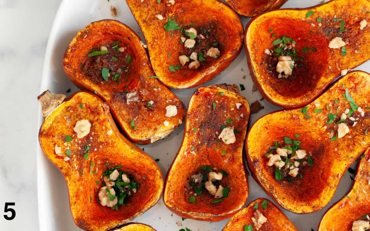 Roasted honeynut squash on a serving platter.