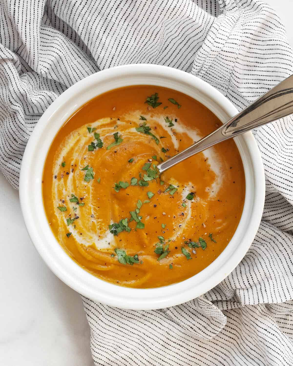 Bowl of creamy roasted kabocha squash soup.