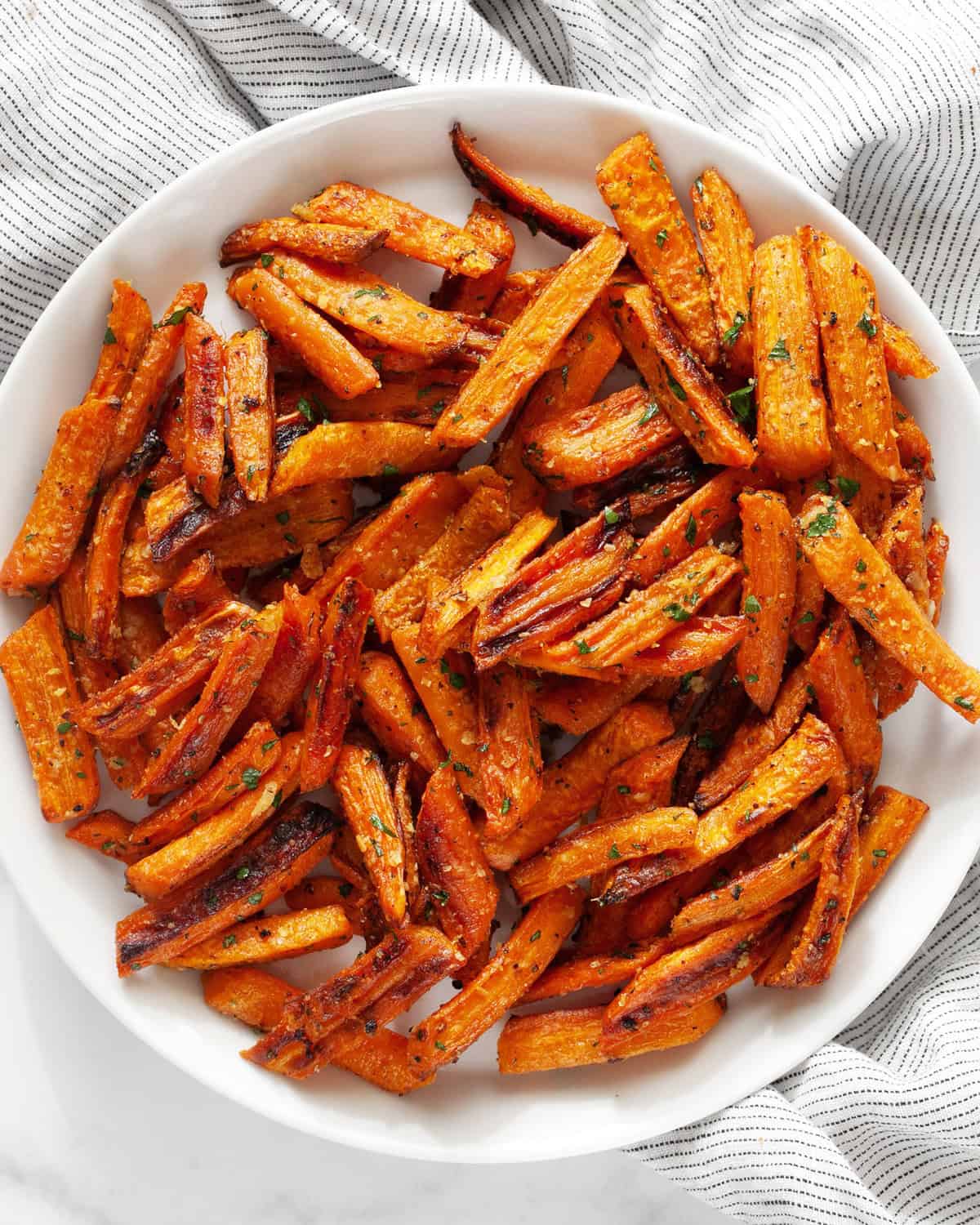 Parmesan garlic roasted carrots on a plate.