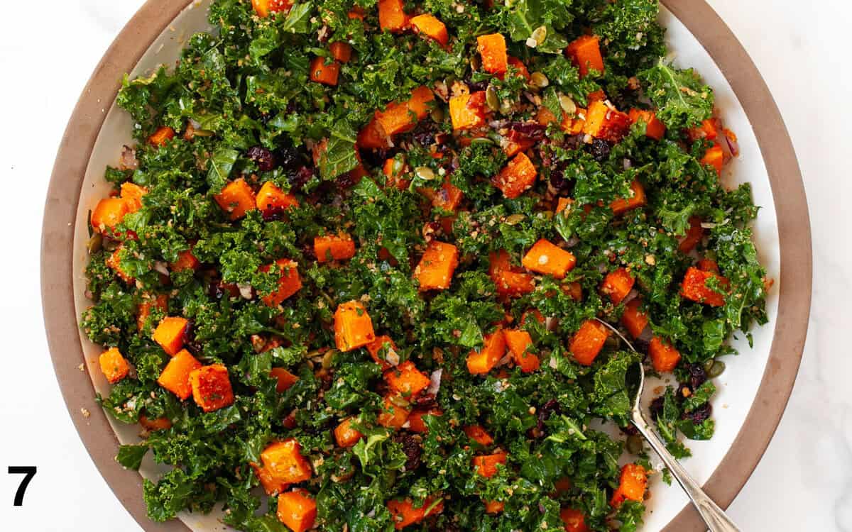 Salad ingredients all tossed together in a large bowl.