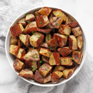 Roasted yukon gold potatoes in a bowl.