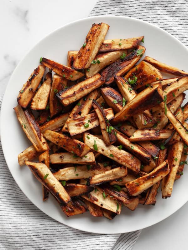 Roasted parsnips on a plate.