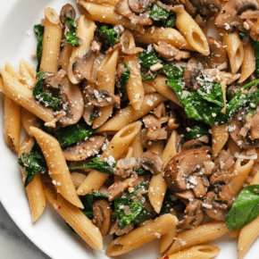 Mushroom spinach pasta on a plate.